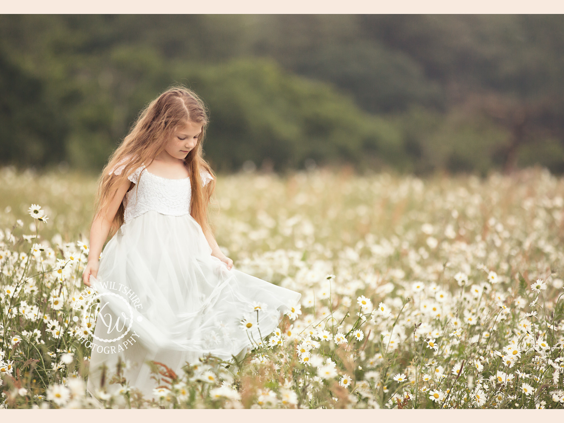 Long haired girl in wild daisies