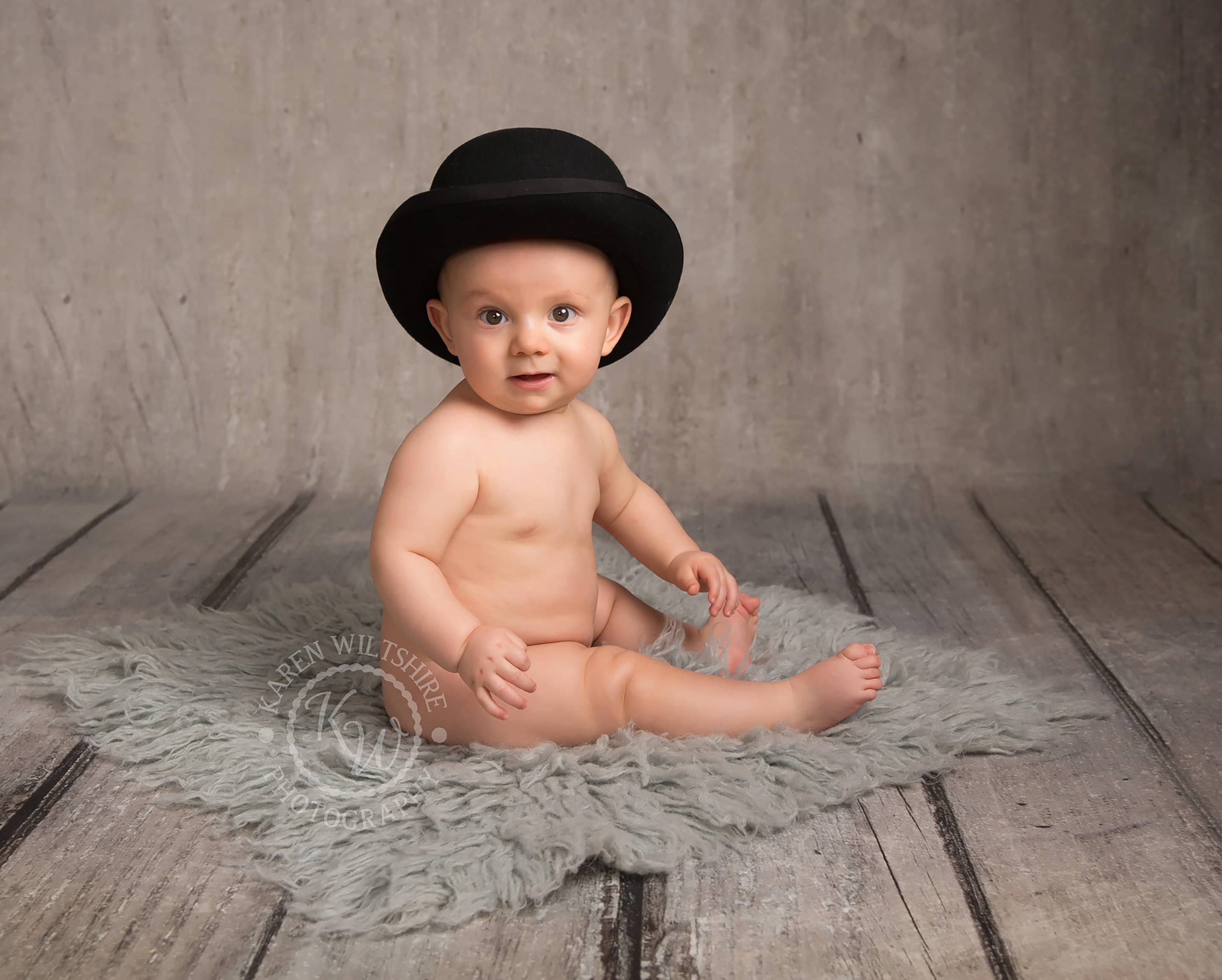 Baby photographer Poole,naked baby in bowler hat