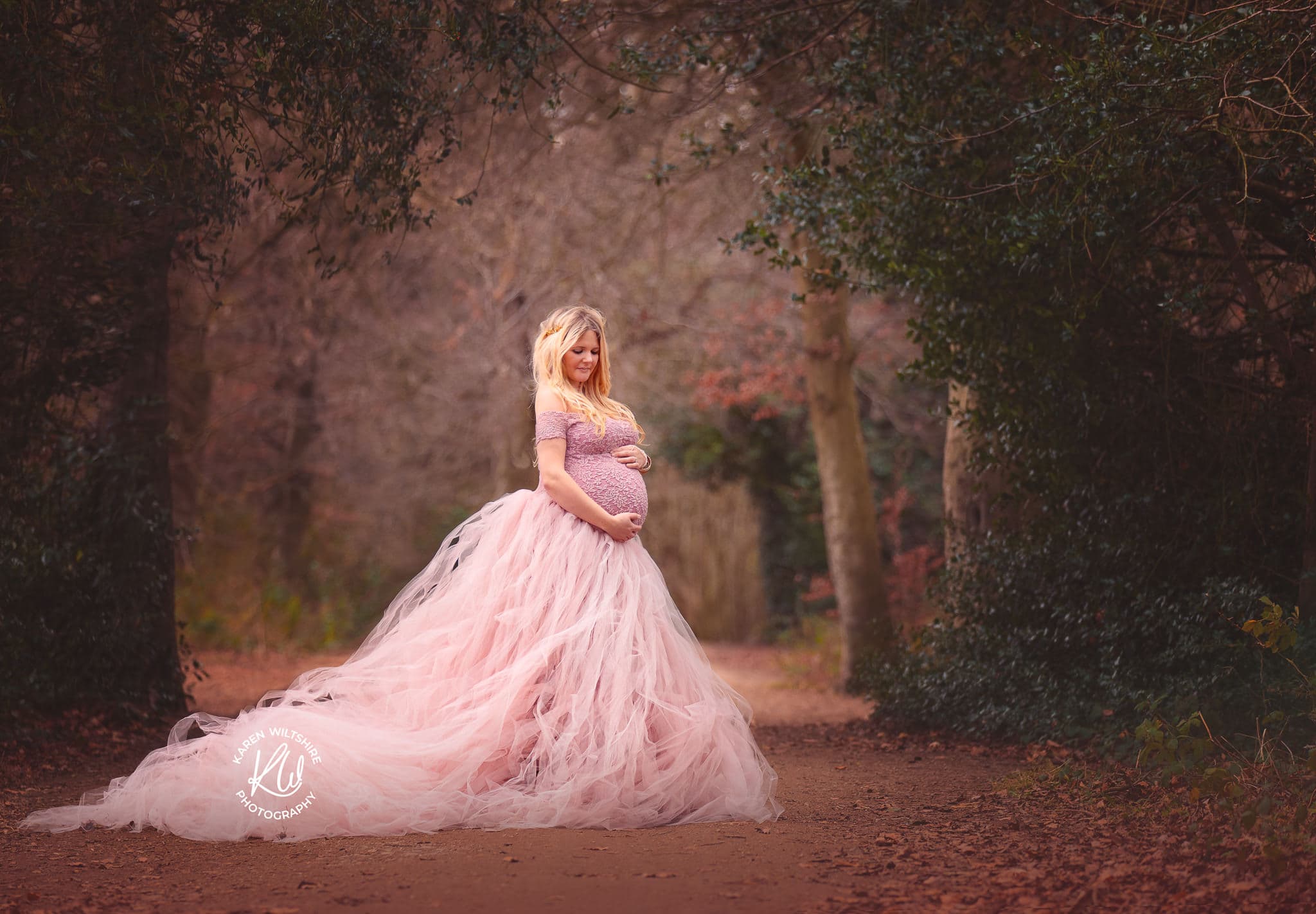 pregnant lady in pink tutu outside in nature